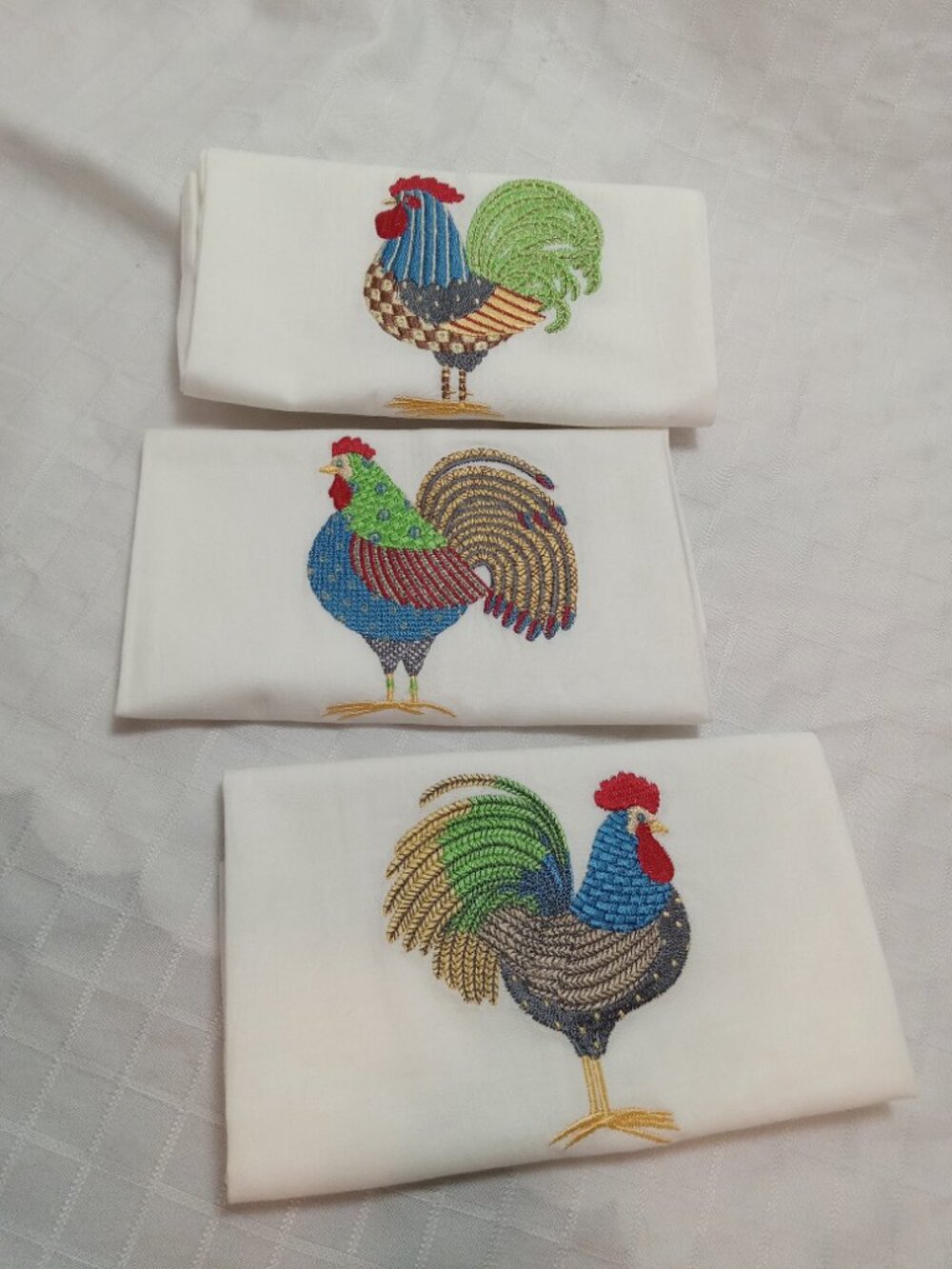 Set of three cotton placemats or hand towels with embroidered rooster designs